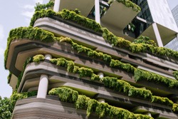 Green nature facade on modern futuristic building in Singapore city