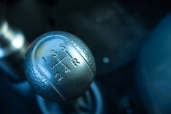 Old style of gear shifter, classic vintage on manual car with 5 speed on blurred background. Space for text or logo etc., 
