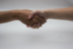 gaussian blur  image of shaking hands for business agreement concept