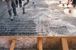 Concrete pouring during commercial concreting floors of buildings in construction - concrete slab - foundation construction