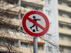 No ball games allowed sign in a residential neighborhood. Restriction for children in the area. Prohibition to play football in Germany. It is forbidden to have fun.