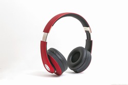 Red headphone isolate on white background.