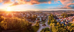 Aerial panorama of a European town at sunrise, with magnificent colorful sky and warm light