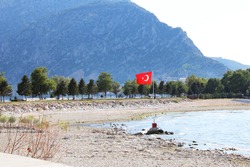 A Turkish Flag in Egirdir Lake, Isparta City, Turkey. Beach of Egirdir Lake.