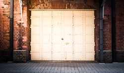 steel Door in a red brick wall background