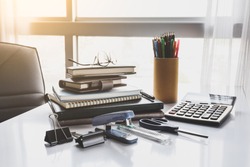 School and office stationary on white desk in office