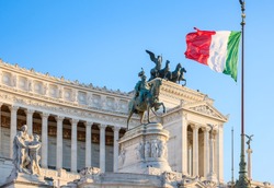 Detail of the Monumento Nazionale a Vittorio Emanuele II in Rome under the Italian national flag. Rome, Italy