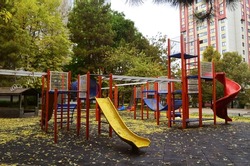 Empty children playground in autumn during lockout for Covid-19 pandemic