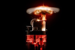 Photograph of a red backlit cigarette lighter on a black background. Concept photo. Lighter showing a nuclear explosion instead of a simple flame.