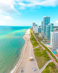 Amazing turquoise ocean water on a white sand beach in Miami Beach Florida USA