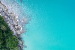 Aerial view Top down seashore wave crashing on seashore Beautiful turquoise sea surface in sunny day Good weather day summer background
