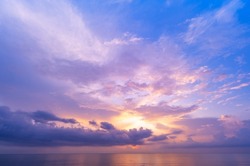 Landscape Long exposure of majestic clouds in the sky sunset or sunrise over sea with reflection in the tropical sea Beautiful seascape scenery, Amazing light of nature sunset background