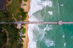 Amazing small bridge in to the summer sea, High angle view Beautiful sea surface waves crashing on sandy shore in sunny day, Beautiful seascape nature landscape