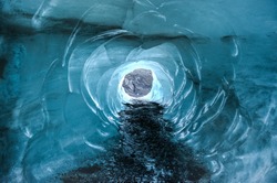 Myrdalsjokull Glacier Iceland. Icelandic for mire valley glacier. View of a tunnel leading through the glacier itself.