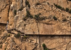 Wooden structure on the mountain to save the precipice and not fall into the void. Great rock block for climbing. Famous Caminito del Rey in Malaga, Spain. Copy space
