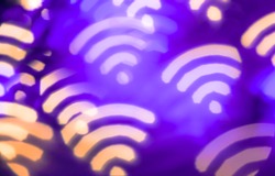 Wifi symbol. Abstract glowing blurred background. Bokeh. Defocused blinking shaped lights. Wi-fi backdrop