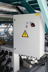 Grey Hinged Power Supply Box in industrial workshop