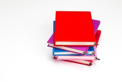 Stack of colorful books isolated on the white