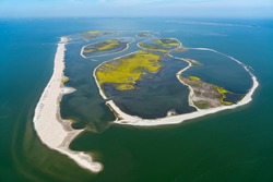 Aerial view of an artificial island in Lake Markermeer, Holland. These 'Marker Wadden', mud flats, form a unique ecosystem that will boost biodiversity in the Netherlands. IJsselmeer on the horizon.