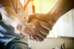Business partnership meeting concept. Image businessman handshake. Successful businessmen handshaking after good deal. Horizontal, blurred background
