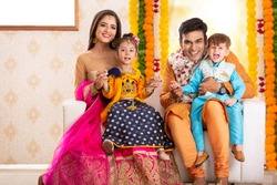 Happy Diwali Festival Family Celebration. Family enjoying Diwali Celebration at home