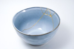 Blue kintsugi bowl, Gold cracks restoration, Pottery fixed with the antique Japanese Kintsugi restoration technique. The beauty of imperfections