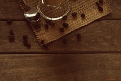 coffie,coffie beans,cup,spoon,wooden table top view