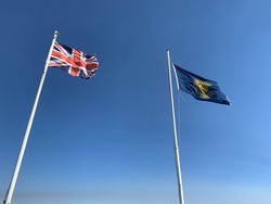 British and Commonwealth Flags flying in strong westerly wind