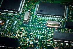 Electronic computer circuit board close up.
