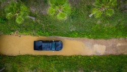 Aerial view off-road car vehicle, car 4x4 wheel drives off-road, Black truck car 4x4 adventure over river view from above.