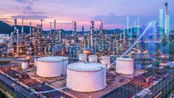 Oil refinery factory plant and oil storage tank with business graph analysis at twilight, Eoconomy Oil refinery and Petrochemical plant.