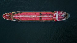 Aerial top view oil tanker logistic and transportation in the open sea.