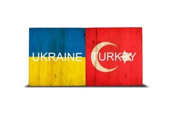 Flags of Ukraine and Turkey on wooden blocks. Isolated on white background. Commonwealth. Support. Cooperation. Politics. Economy.