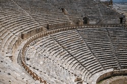 Ruins of theater in ancient Hierapolis now Pamukkale Turkey. Amphitheater (Coliseum) in ancient city Ephesus, Turkey in a beautiful summer day