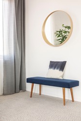 Blue settee with pillow in elegant waiting room