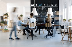 People working in modern, creative work environment