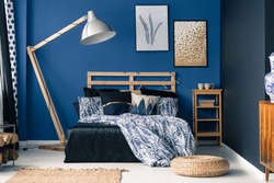 Royal blue bedroom interior with a touch of gold