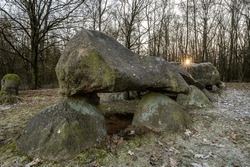 Dutch hunebed or dolmen D26 around sunset in wintertime - Drouwenerveld, Drenthe, The Netherlands.