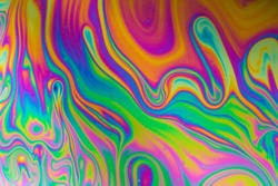 Psychedelic abstract formed by light interference on the surface of a soap bubble