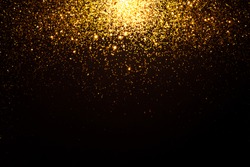 Gold falling sparkles on black background. Festive concept.