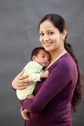 Young mother holding newborn baby