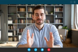 Businessman participate at virtual distant negotiations with colleagues via teleconference. Talk with clients provide information strategizing remotely. Video call self-isolation during ncov situation