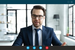 Head shot employer lead job interview with applicant laptop screen teleconference app view. Businessman talk with client by video call communicating distantly use modern videoconference and pc concept