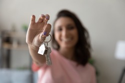 Crop close up of female tenant renter show praise house keys moving to first own new apartment or house, happy woman owner buy purchase home, relocate to dwelling, rental, rent, ownership concept