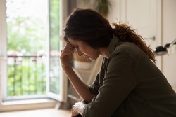 Worried frustrated young woman feeling depressed and lonely, suffering from stress and nervous breakdown after emotional trauma, needing psychological help. Depression, mental healthcare concept
