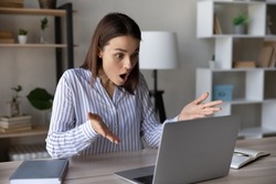Stressed shocked computer user staring at laptop screen with open mouth in surprise, having problems with software, getting unexpected bad news, feeling stress about app or services errors