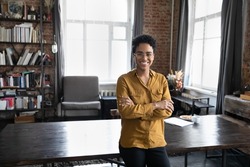 Happy confident young Black business woman, freelance professional, entrepreneur head shot portrait. Cheerful short haired female leader, employee posing in home office. Corporate head shot portrait