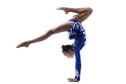 Beautiful gymnast athlete teenage girl wearing dancer blue leotard working out, dancing, doing backbend, handstand exercise, back walkover, full length, studio, white background, isolated