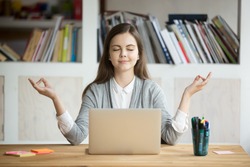 Calm woman relaxing meditating with laptop, no stress free relief at work concept, mindful peaceful young businesswoman or student practicing breathing yoga exercises at workplace, office meditation