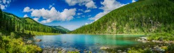 Panoramic view on mountain lake in front of mountain range, national park in Altai republic, Siberia, Russia